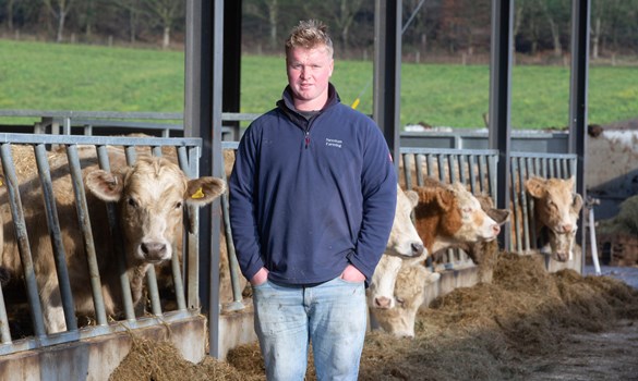 Strategic Farmer, Bertie Newman, with cows behind